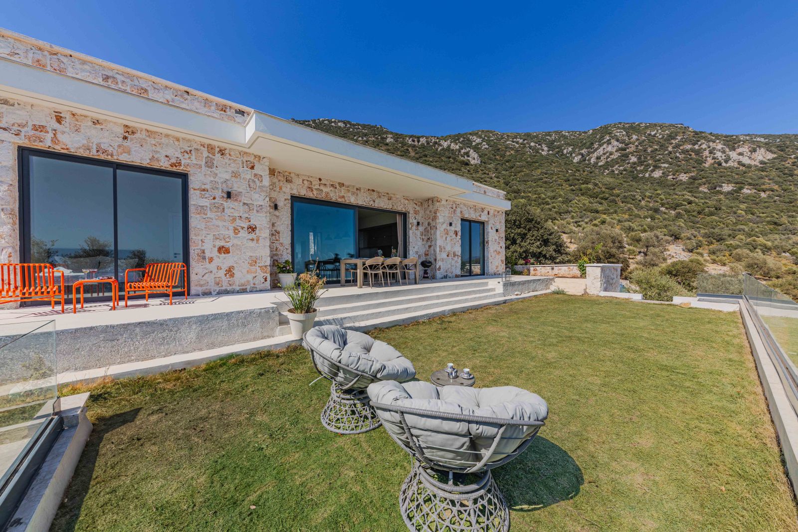 A stone villa terrace in a Mediterranean hillside setting